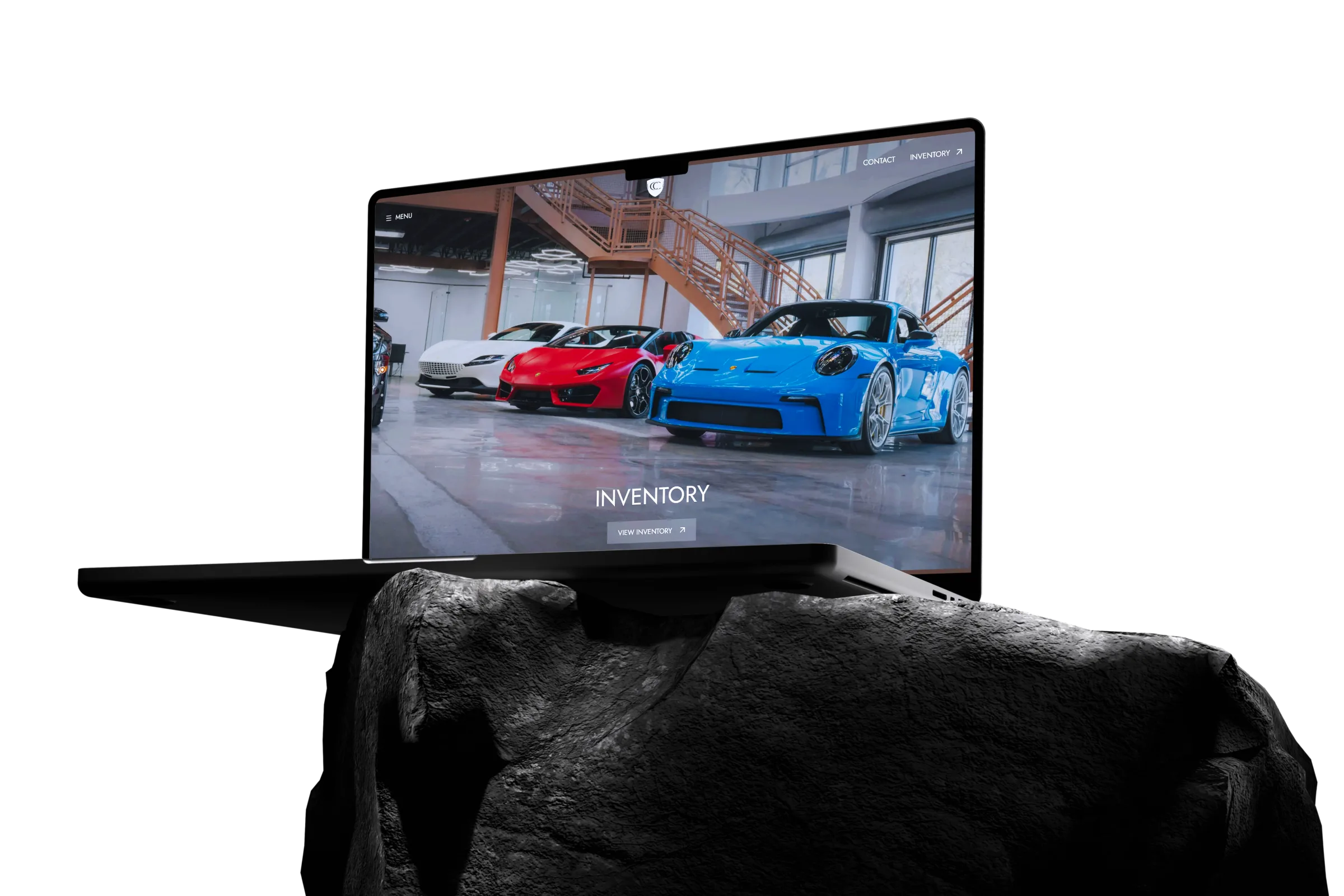 Automated dealership inventory website shown on a laptop